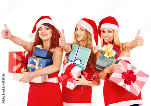 Girl in Santa hat holding Christmas gift box.