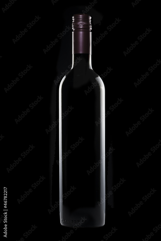 Bottle of red wine on black background