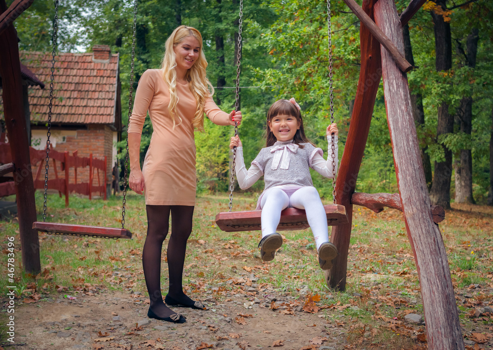 Portrait Of Mother And Child Relaxing In Park Portrait Of Mother And Child Relaxing In Park