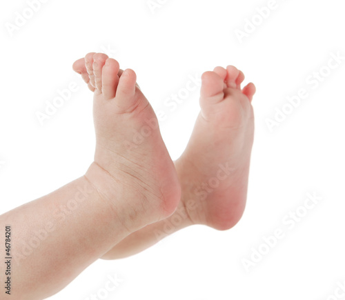 Close up of baby feet isolated on white background