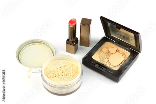 Cosmetics isolated: used lipstick and crushed powder