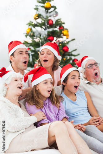 Extended family singing carols