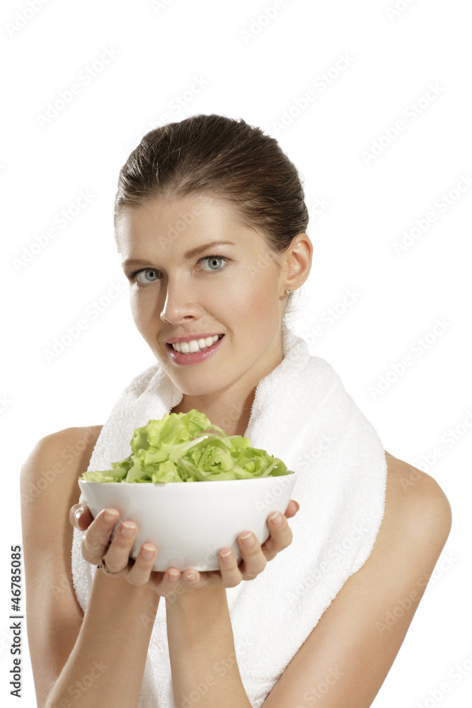young woman eating salad after fitness young woman eating salad after fitness