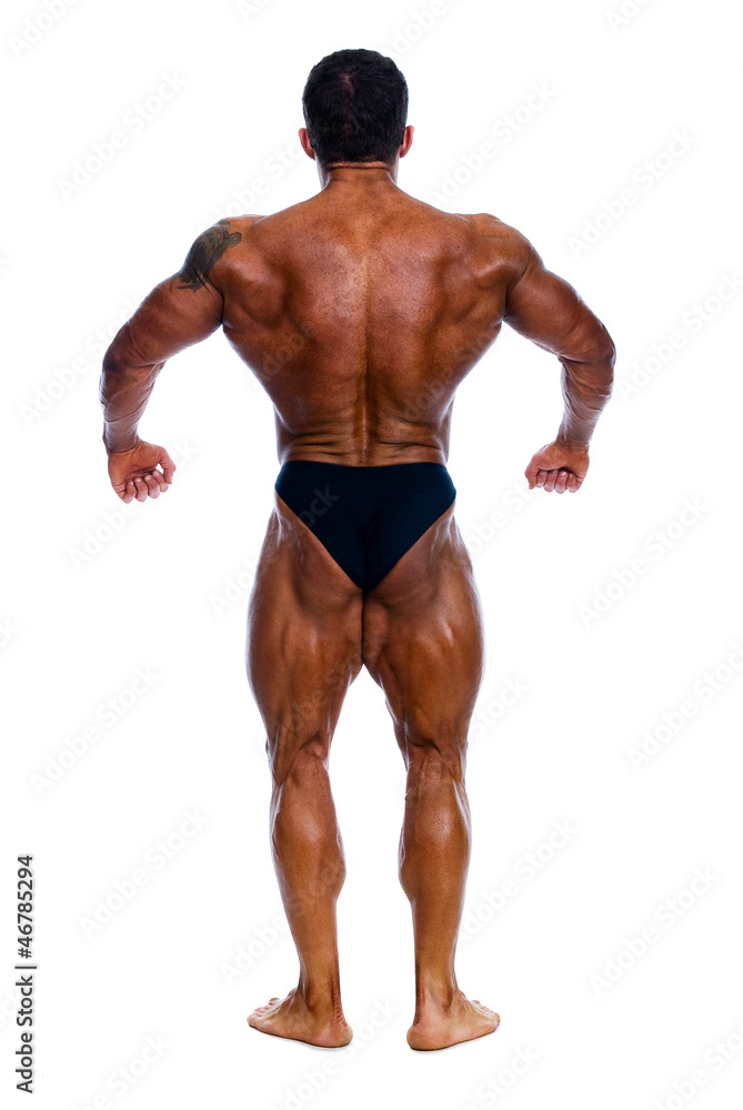 Muscled male model posing in studio Muscled male model posing in studio