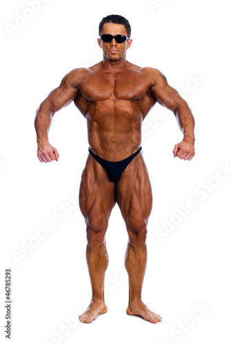 Muscled male model posing in studio