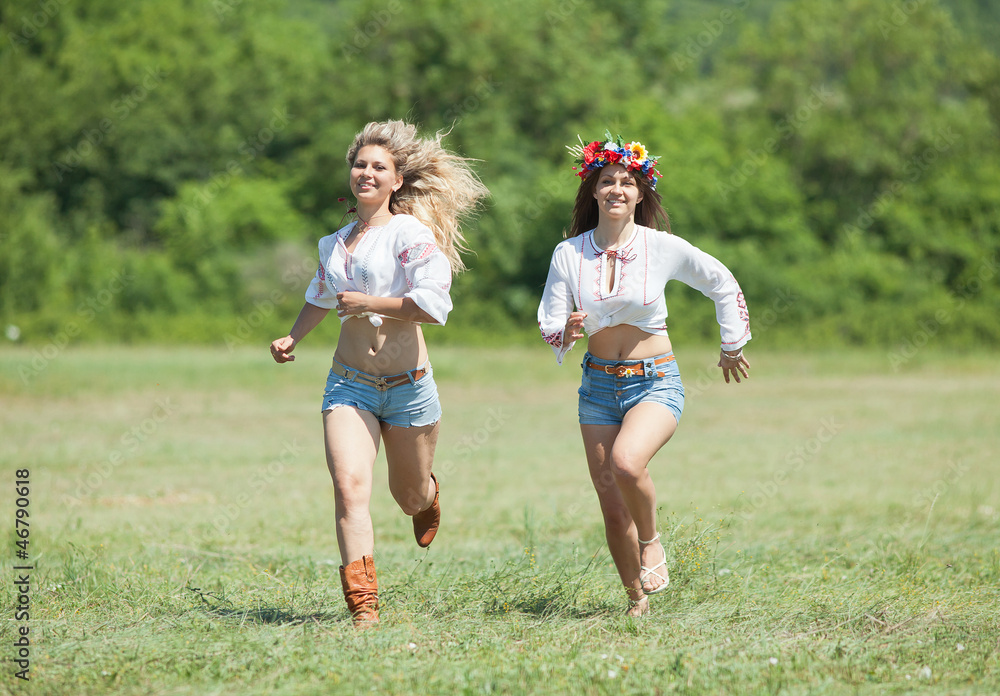 Fototapeta premium Ukrainian girls in field