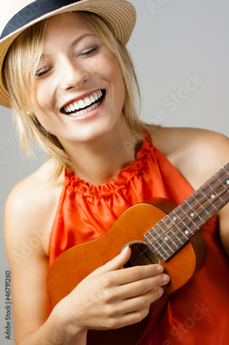 Beautiful Woman Playing Guitar photo