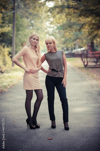 Fototapeta Naklejka Na Ścianę i Meble -  two smiling attractive young women outdoors