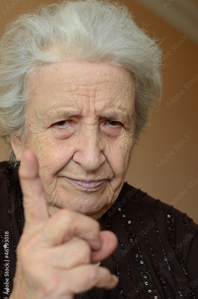 old woman with her finger up for admonition old woman with her finger up for admonition