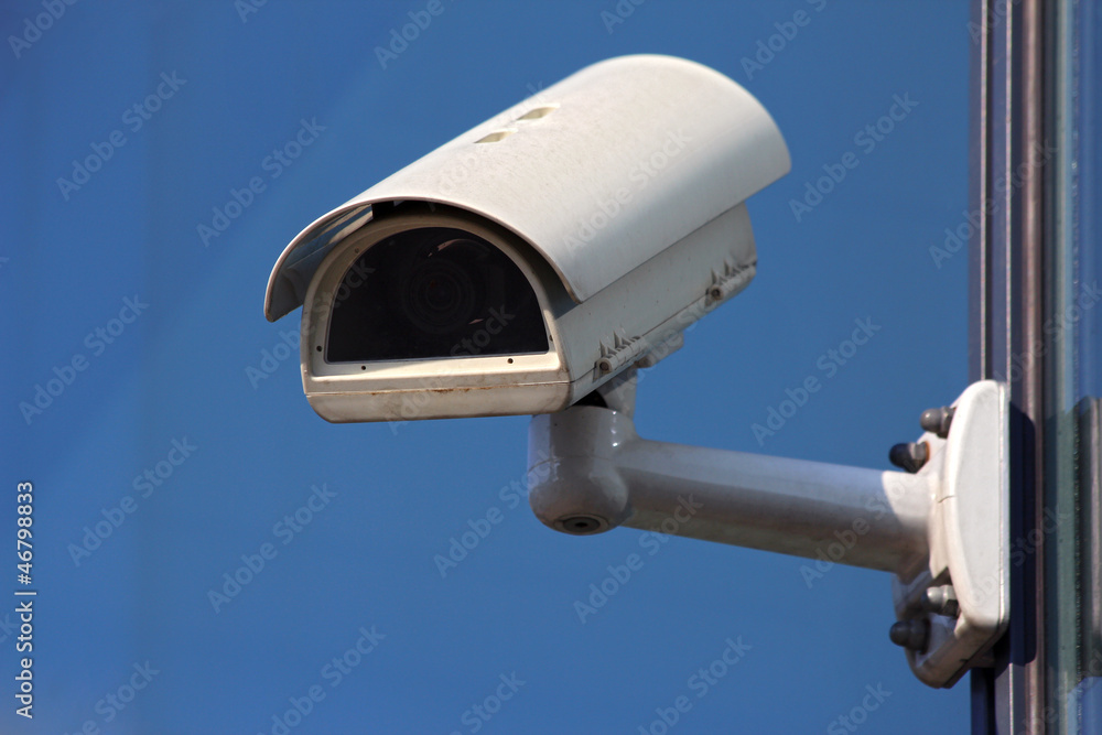 white cctv security camera on blue background white cctv security camera on blue background
