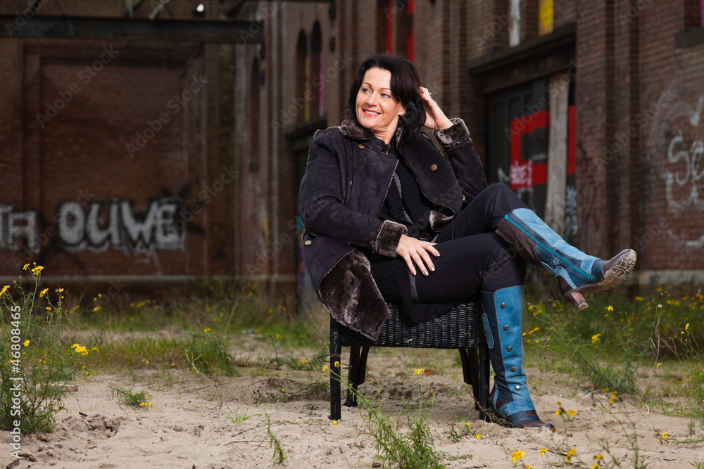 Urban fashion portrait of pretty woman with black hair. Urban fashion portrait of pretty woman with black hair.