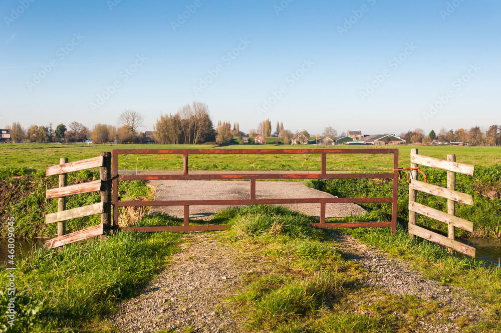 Closeup of a fence in a Dutch polder landscape