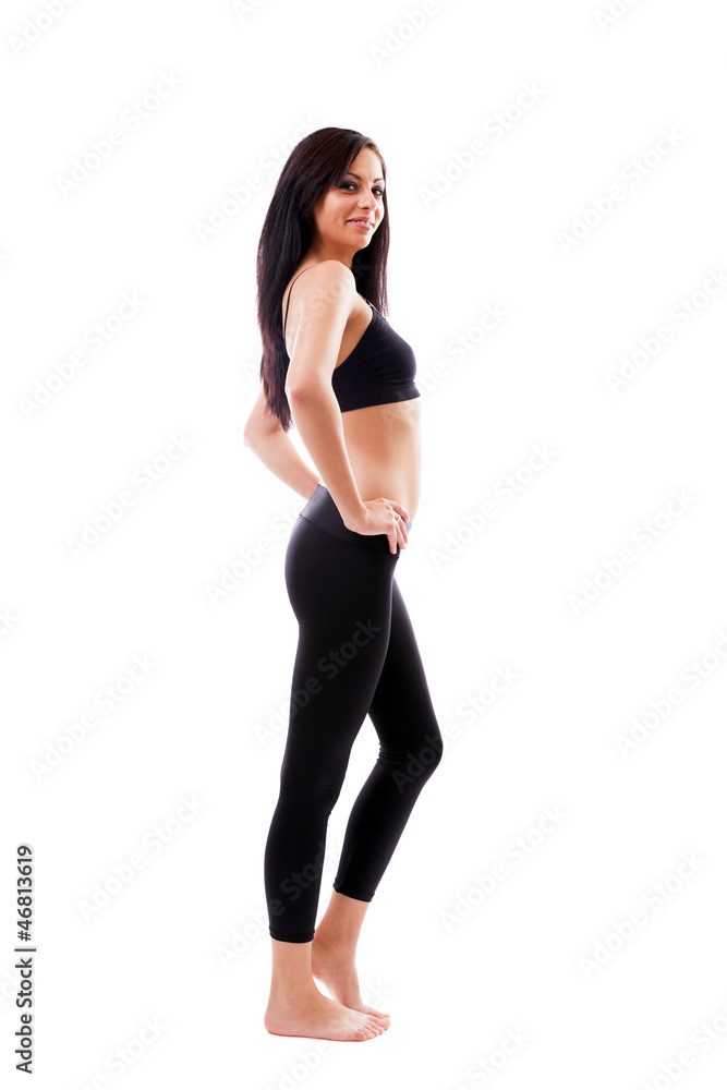 Sporty latin woman standing with hands on hips Sporty latin woman standing with hands on hips