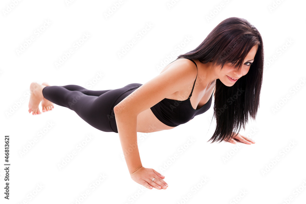 Hispanic woman doing pushups isolated on white background