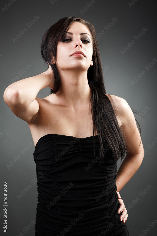 Beautiful latin woman standing with hand on hip