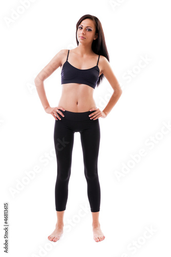 Sporty latin woman standing with hands on hips