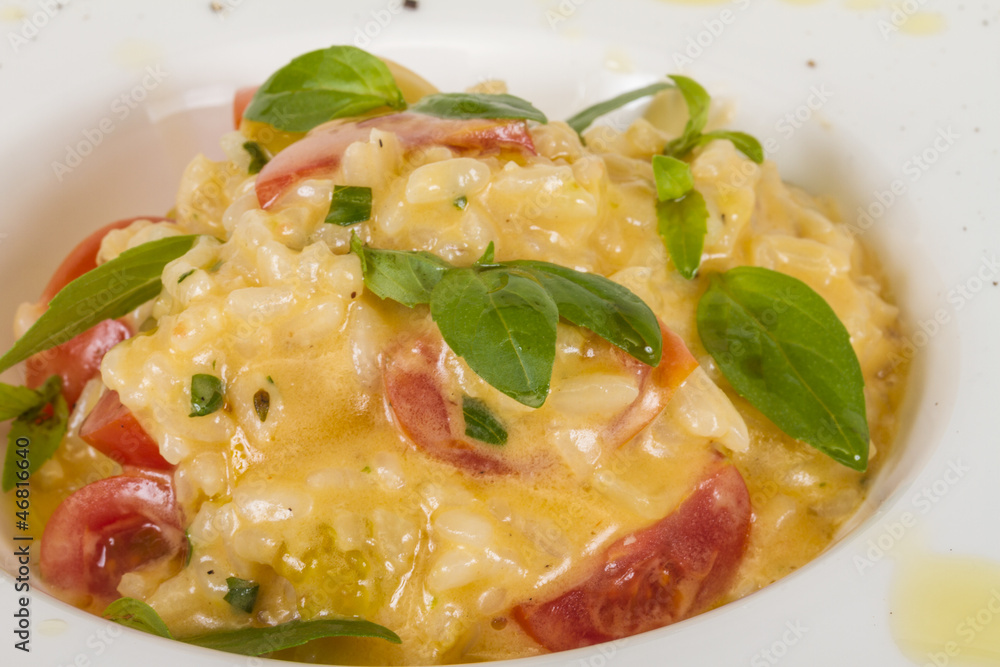 photo of delicious risotto dish with herbs and tomato on white b photo of delicious risotto dish with herbs and tomato on white b