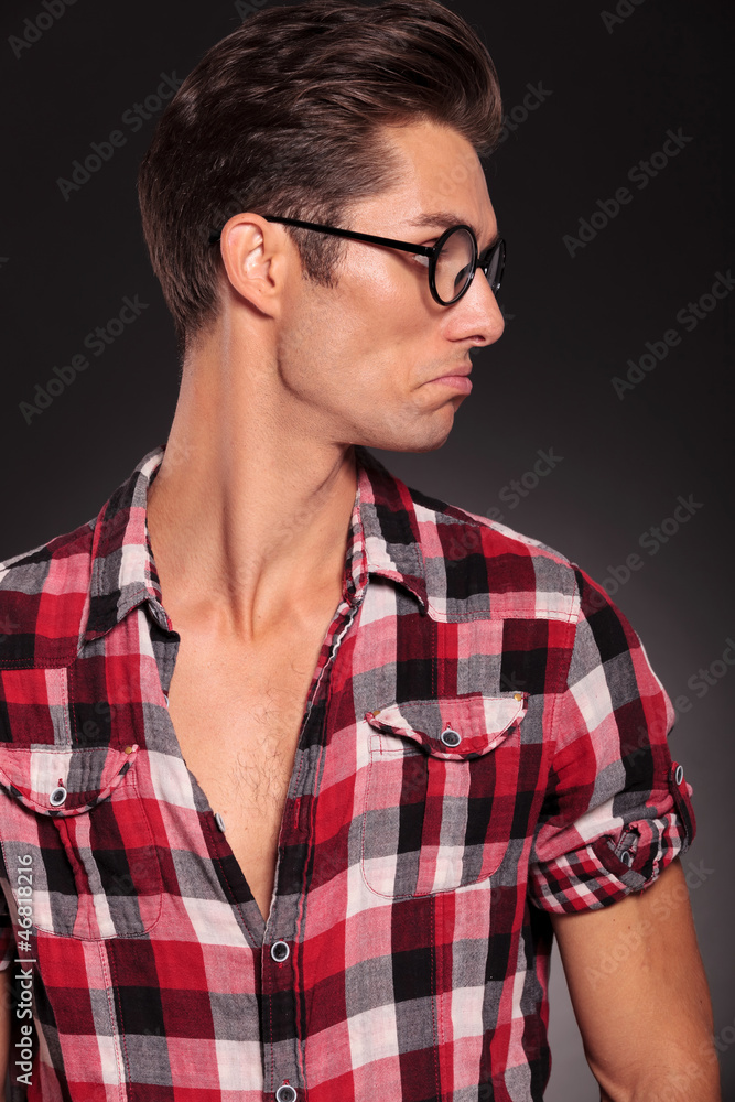 confused casual man looking to his left side confused casual man looking to his left side