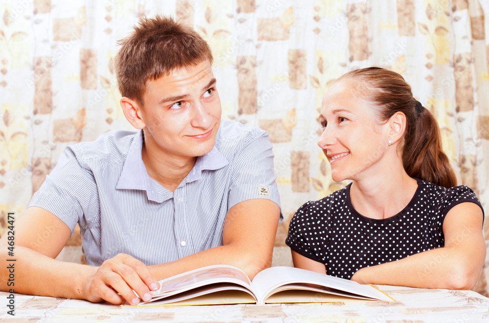 Obraz premium Two happy people learning together in the classroom