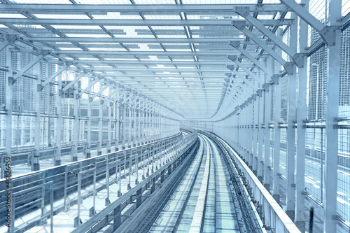 Tokyo monorail transportation system line metal tunnel. Blue ton