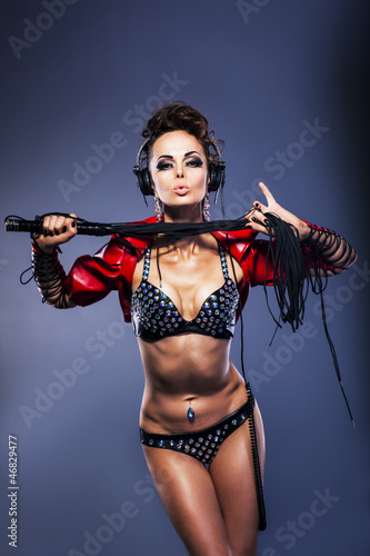 Photos Sexy fetish woman dj in lingerie holding whip with headphones