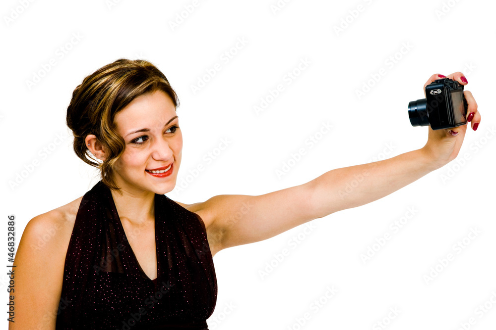 Happy teenage girl photographing