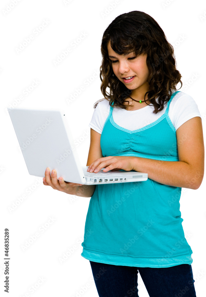 Latin American teenage girl using a laptop Latin American teenage girl using a laptop