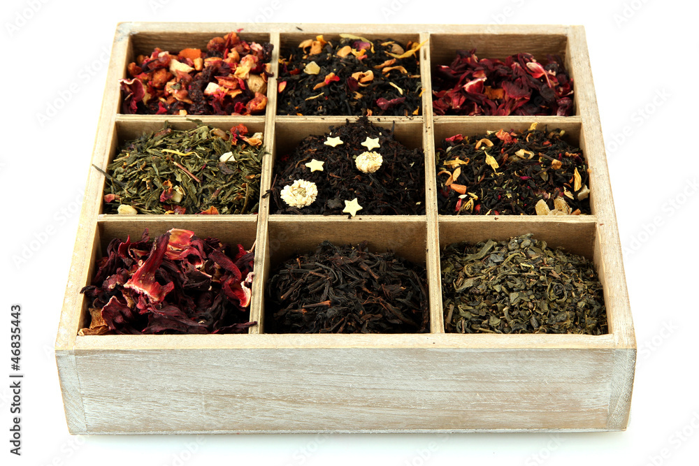 assortment of dry tea in wooden box, isolated on white assortment of dry tea in wooden box, isolated on white