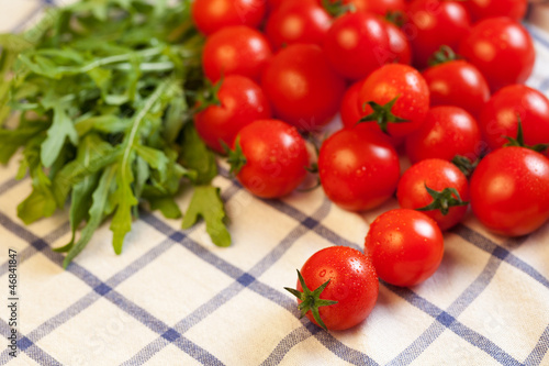 Tomatoes and rucola on towel