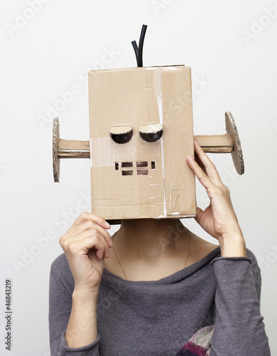 Woman with a cardboard box on his head.