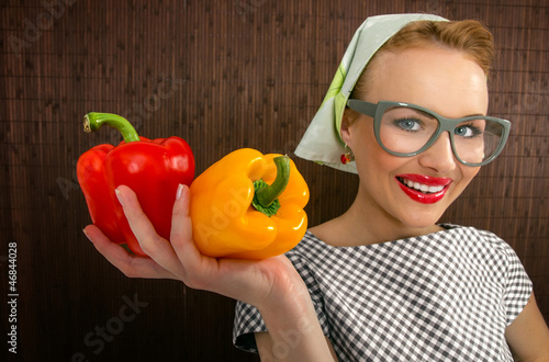 Funny woman cook holading sweet pepper, close up-FOCUS ON PEPPER