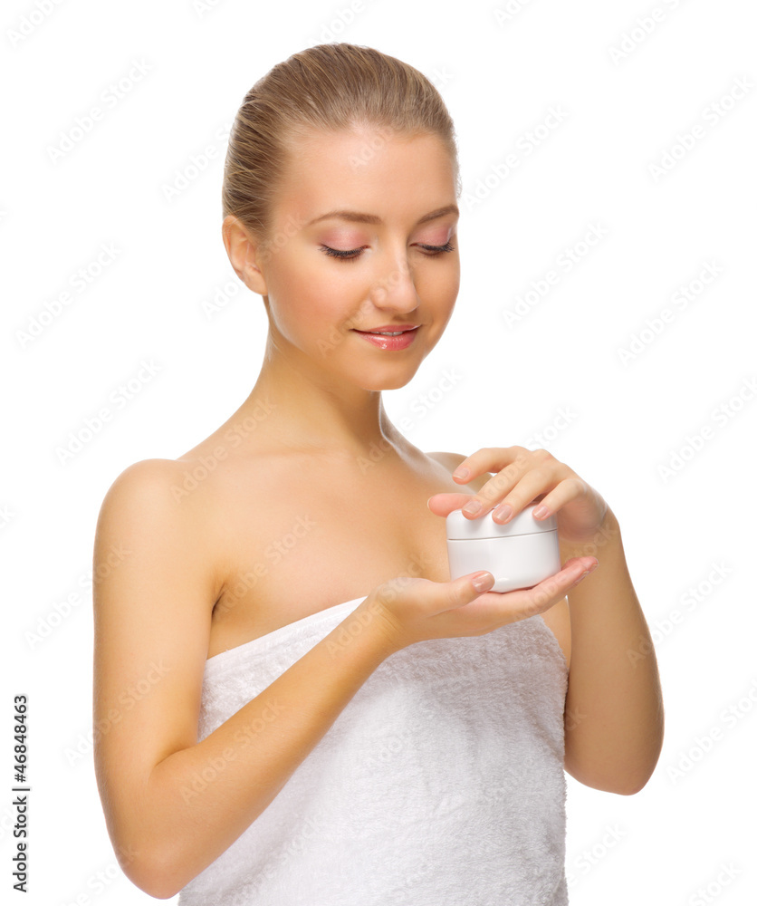 Young smiling girl with body cream Young smiling girl with body cream