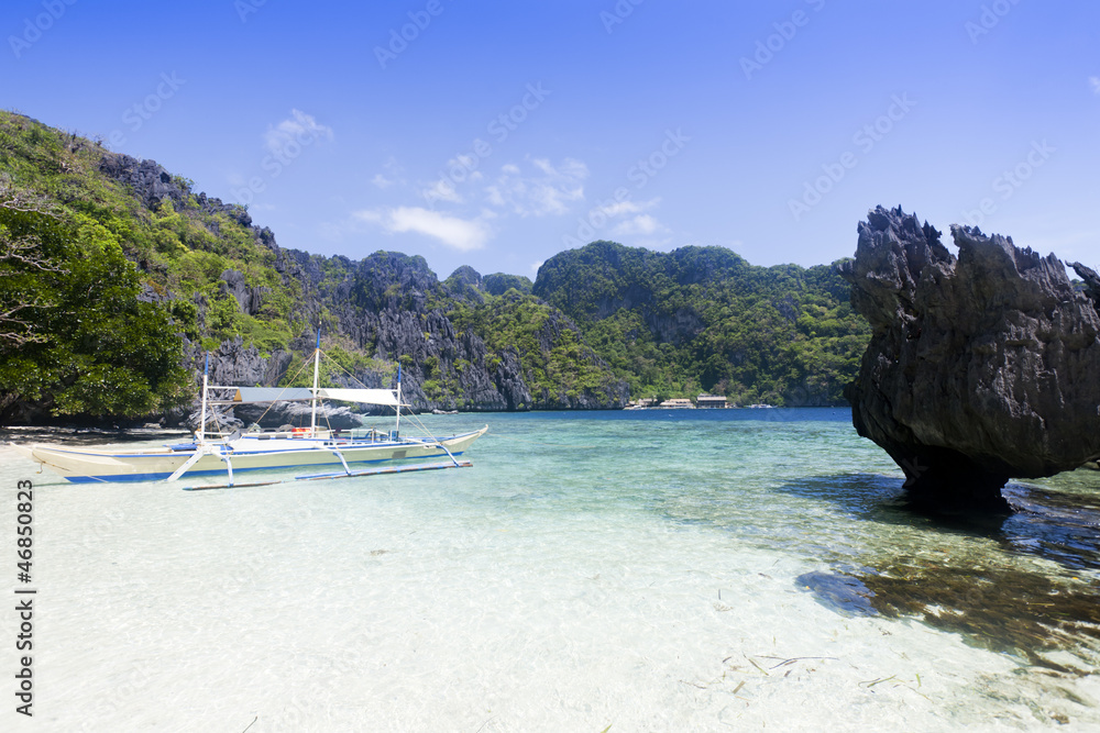 Fototapeta premium A passenger ship moored at beach, El Nido, Philippines.