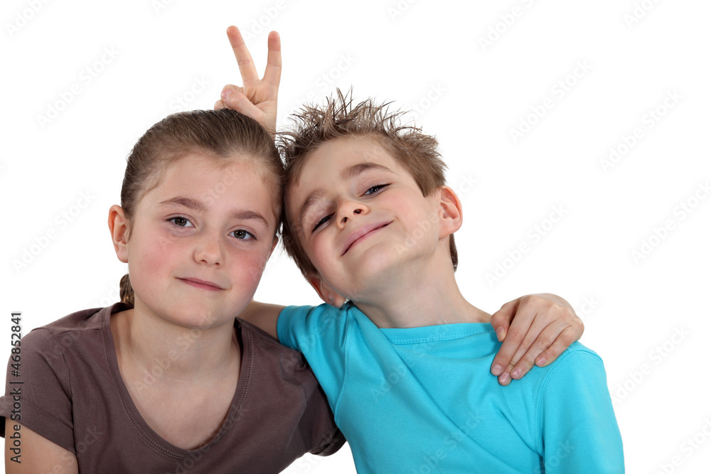portrait of schoolgirl posing with classmate portrait of schoolgirl posing with classmate