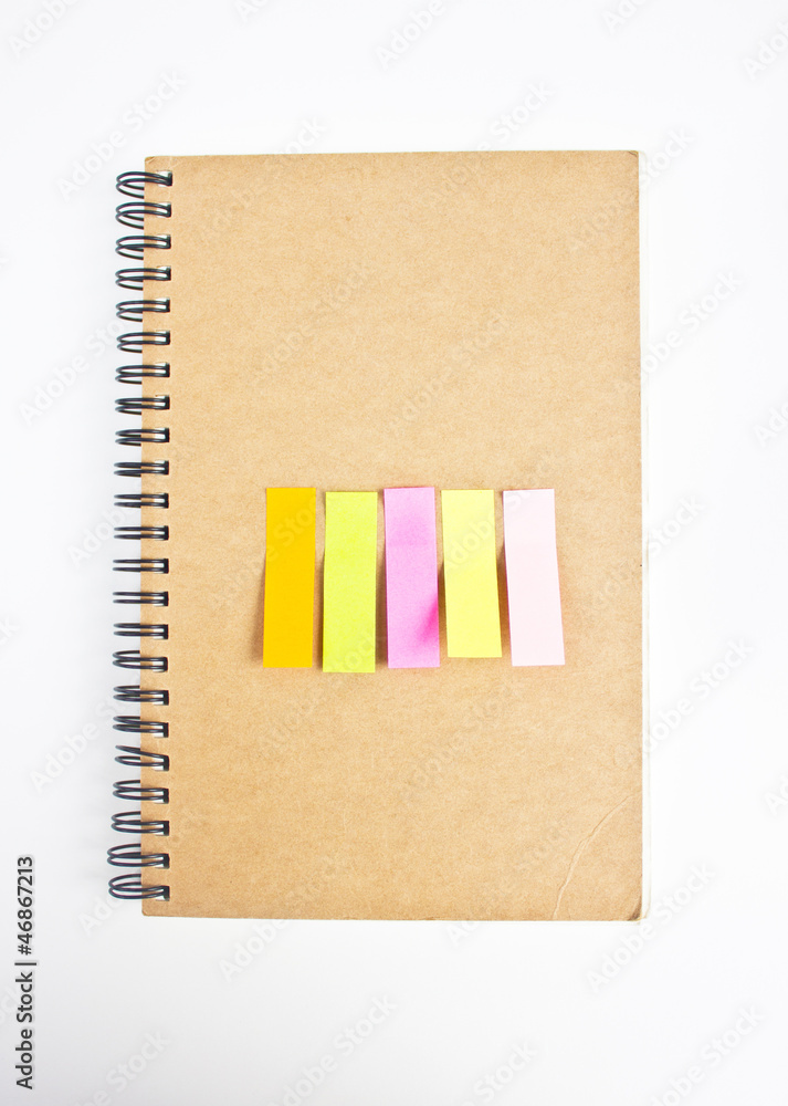 Colorful sticky notes on notebook's cover. Colorful sticky notes on notebook's cover.