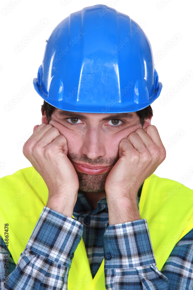 A grumpy and frustrated tradesman A grumpy and frustrated tradesman