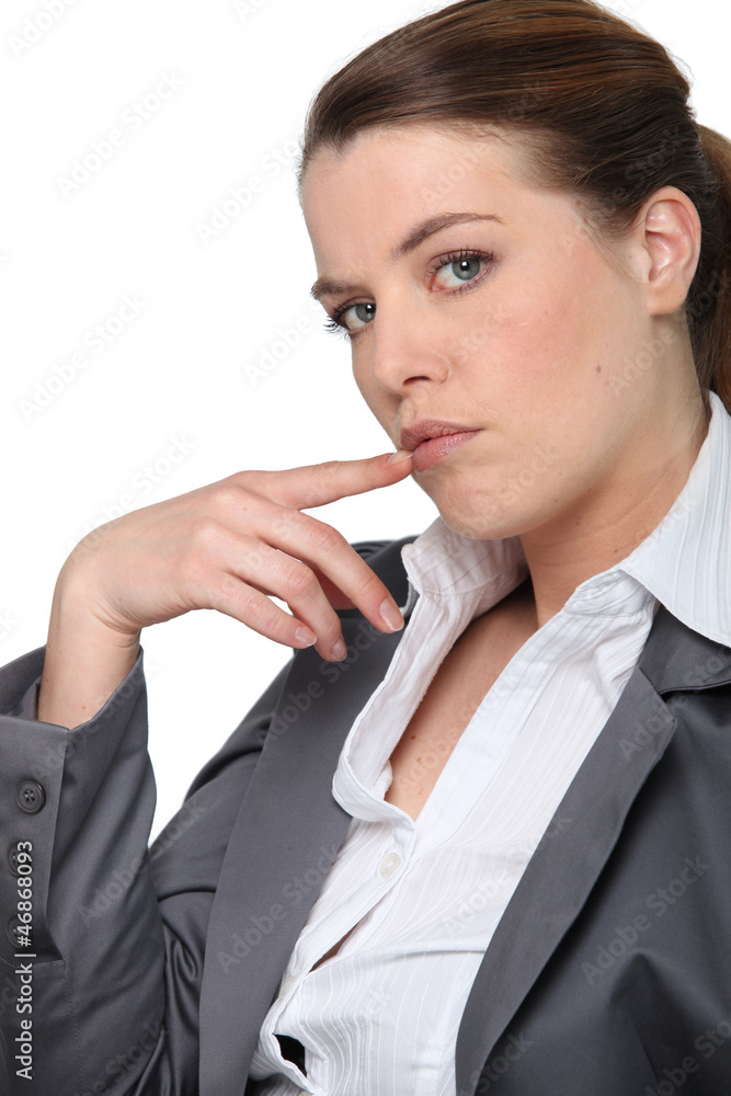 Profile of businesswoman holding hand to face Profile of businesswoman holding hand to face
