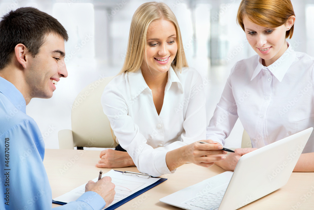 Businesspeople working at meeting Businesspeople working at meeting