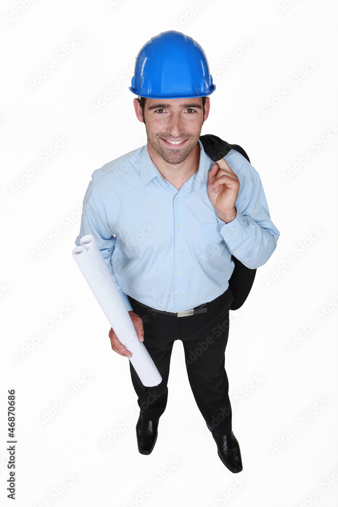 Smiling engineer holding a rolled-up drawing Smiling engineer holding a rolled-up drawing