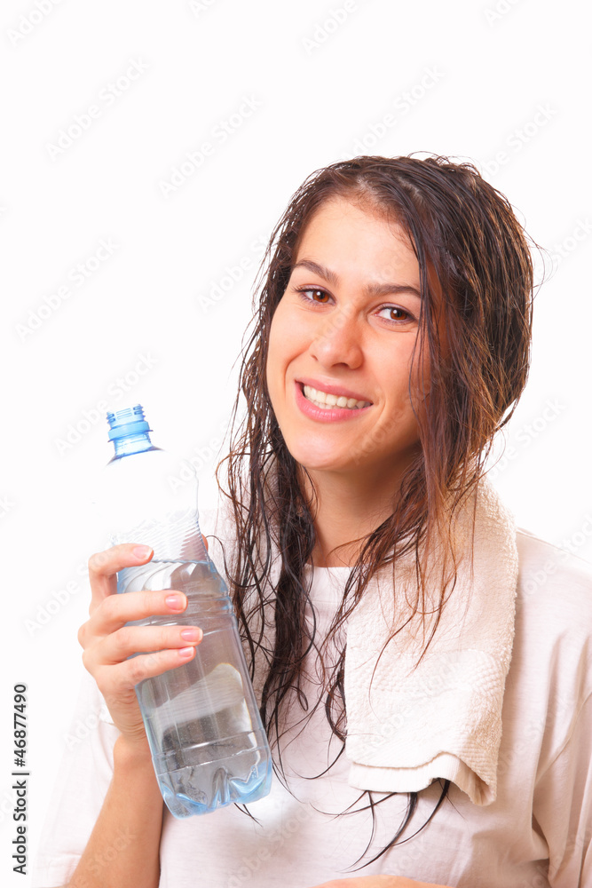 Attractive young brunette woman with bottle of water Attractive young brunette woman with bottle of water