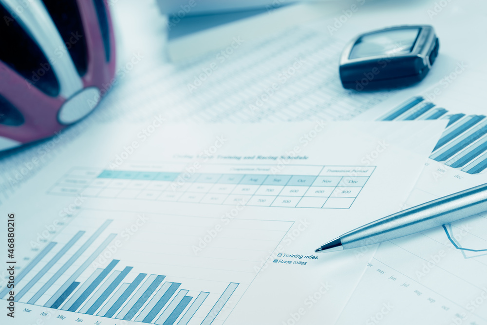 Training and race plan for cycling. Helmet, monitor. Blue toned.