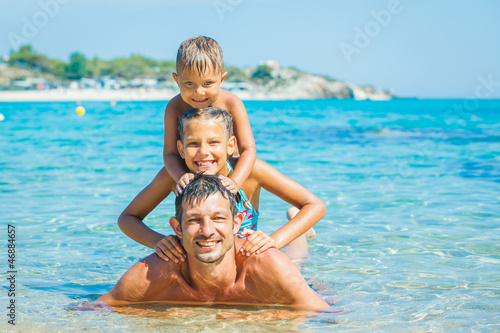 Family playing in the sea