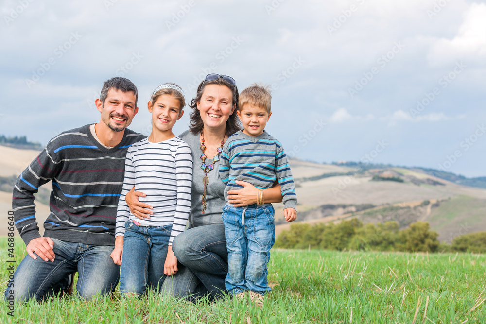 Happy family having fun outdoors in Tuscan Happy family having fun outdoors in Tuscan
