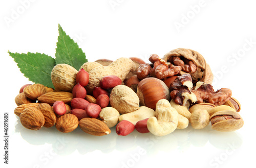 assortment of tasty nuts with leaves, isolated on white