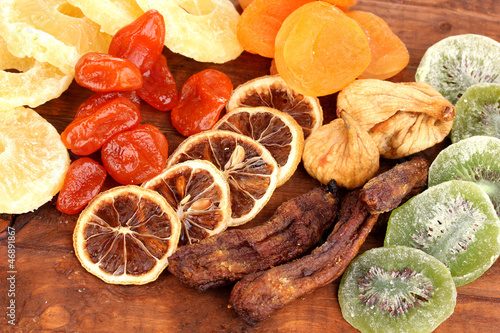 Dried fruits on wooden background