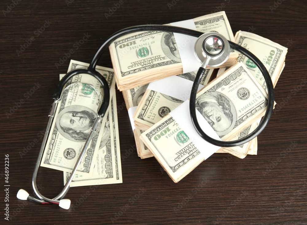 Healthcare cost concept: stethoscope and dollars Healthcare cost concept: stethoscope and dollars