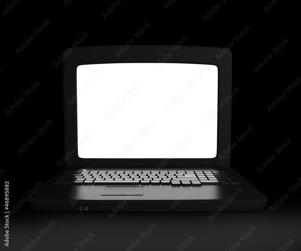 Laptop with white screen glowing in the dark closeup Laptop with white screen glowing in the dark closeup