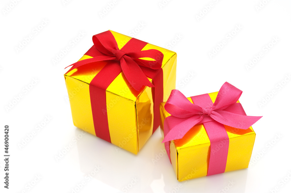 Fototapeta premium Gold gifts on white background.
