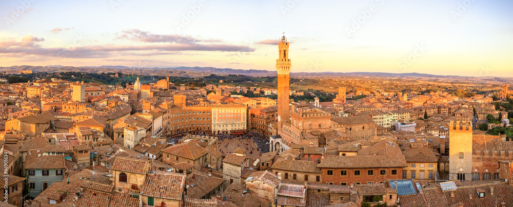 Siena sunset panoramic skyline. Mangia tower landmark. Tuscany,