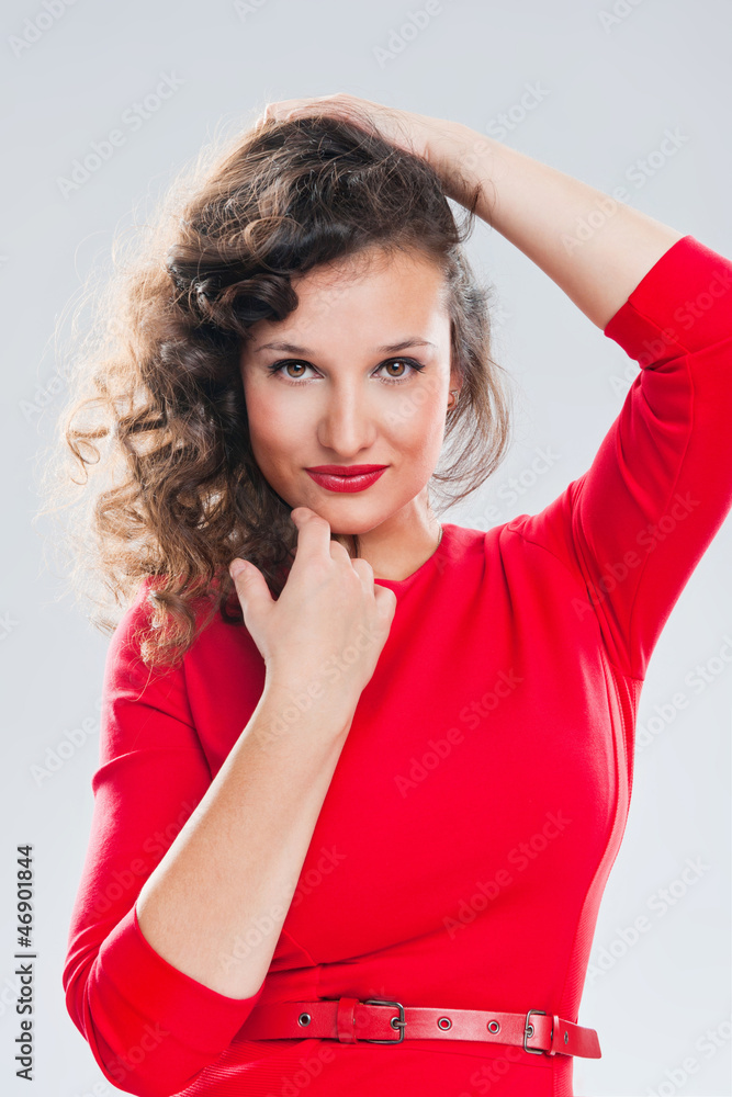 Portrait of a beautiful girl on a gray background Portrait of a beautiful girl on a gray background